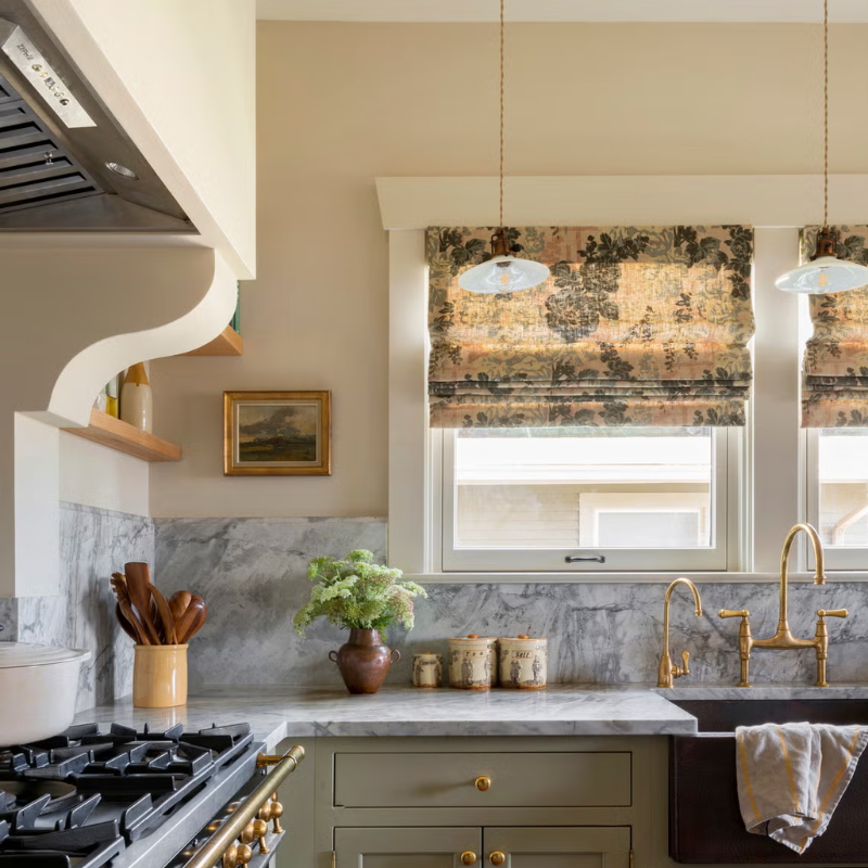 custom kitchen with vintage accents and gold fixtures
