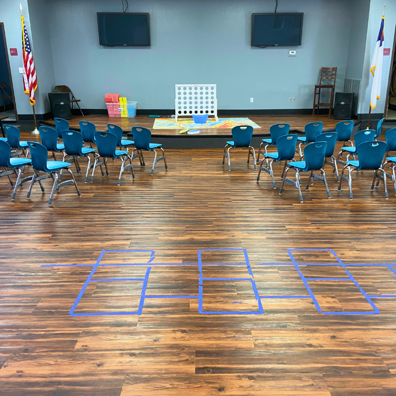 Mixed wood pattern flooring in a church kids' classroom.