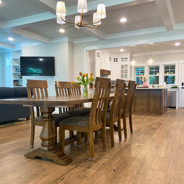 Warm, mesquite hardwood in a large modern farmhouse dining room.
