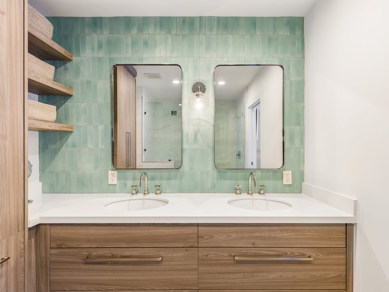 transitional tile with blue backsplash and wood tones